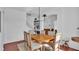 Formal dining room with wooden table, neutral decor, and large window at 4512 Brookshire Pl, Lake Wales, FL 33898