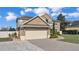 Two-car garage with brick paver driveway at 4512 Brookshire Pl, Lake Wales, FL 33898