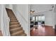 Carpeted staircase with white railing leading to upper level at 4512 Brookshire Pl, Lake Wales, FL 33898