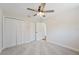 Bright bedroom with carpet flooring, double doors, and ceiling fan at 4718 Valley Hill Ct, Lakeland, FL 33813