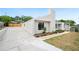 Side view of home with concrete driveway and landscaping, showcasing the well-maintained exterior at 4718 Valley Hill Ct, Lakeland, FL 33813