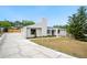 Exterior view of home with landscaping, showcasing the entrance and well-maintained yard at 4718 Valley Hill Ct, Lakeland, FL 33813