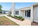Front exterior view of home with landscaping, showcasing the entrance and well-maintained yard at 4718 Valley Hill Ct, Lakeland, FL 33813