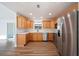 Modern kitchen with wood cabinets and stainless steel appliances at 4718 Valley Hill Ct, Lakeland, FL 33813