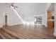 Living area with hardwood floors and sliding doors to patio at 4718 Valley Hill Ct, Lakeland, FL 33813