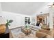 Comfortable living room with hardwood floors, sliding door access to deck and an open view into the kitchen at 4718 Valley Hill Ct, Lakeland, FL 33813