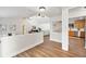 Bright living room featuring wood floors and an open transition to the kitchen and other living spaces at 4718 Valley Hill Ct, Lakeland, FL 33813