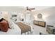 Well-lit main bedroom showcasing carpet floors, a ceiling fan, and a view into an open closet at 4718 Valley Hill Ct, Lakeland, FL 33813