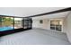 Screened patio shows backyard and pool view, with sliding doors to the house, ideal for outdoor living at 4718 Valley Hill Ct, Lakeland, FL 33813