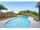 Backyard pool features a concrete deck and surrounding wooden fence, offering a private outdoor retreat at 4718 Valley Hill Ct, Lakeland, FL 33813