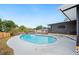 Backyard pool features a concrete deck and screened in porch, offering a private outdoor retreat at 4718 Valley Hill Ct, Lakeland, FL 33813