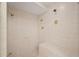 Large walk-in shower with multiple shower heads and tiled walls at 4718 Valley Hill Ct, Lakeland, FL 33813