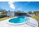 Beautiful kidney-shaped pool in a sunny backyard at 4718 Valley Hill Ct, Lakeland, FL 33813