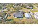 Aerial view of the house, detached garage and surrounding neighborhood at 5125 Pheasant Dr, Mulberry, FL 33860