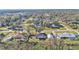 Aerial view of a home showcasing a large backyard, detached garage, and neighborhood setting at 5125 Pheasant Dr, Mulberry, FL 33860