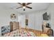 Bright bedroom with double doors and a colorful bedspread at 5125 Pheasant Dr, Mulberry, FL 33860