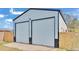 Metal garage with double doors, offering ample storage at 5125 Pheasant Dr, Mulberry, FL 33860