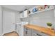 Bright laundry room with built-in cabinets and countertop at 5125 Pheasant Dr, Mulberry, FL 33860