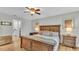 Large main bedroom with ensuite access and wood furniture at 5125 Pheasant Dr, Mulberry, FL 33860