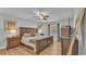 Spacious main bedroom with wood furniture and large windows at 5125 Pheasant Dr, Mulberry, FL 33860