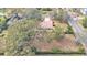 Aerial view of a house with a sizable lot and mature trees, ideal for privacy at 513 E Highland Dr, Lakeland, FL 33813