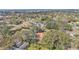 Aerial view of a house and surrounding neighborhood, showcasing the property's location and setting at 513 E Highland Dr, Lakeland, FL 33813