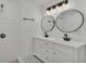 Elegant bathroom with double vanity, large mirrors, and white tile at 513 E Highland Dr, Lakeland, FL 33813