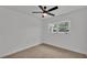 Bright bedroom with neutral walls, ceiling fan, and carpet flooring at 513 E Highland Dr, Lakeland, FL 33813