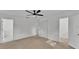 Spacious bedroom with carpet, ceiling fan, and an attached bathroom at 513 E Highland Dr, Lakeland, FL 33813