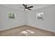 Bright bedroom with neutral walls, ceiling fan and carpet flooring at 513 E Highland Dr, Lakeland, FL 33813