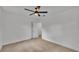 Bright bedroom with ceiling fan and carpet at 513 E Highland Dr, Lakeland, FL 33813