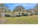 House exterior with a large yard and trees at 513 E Highland Dr, Lakeland, FL 33813