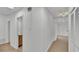 Bright hallway with light wood flooring at 513 E Highland Dr, Lakeland, FL 33813