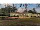 Back of house with brick patio at 513 E Highland Dr, Lakeland, FL 33813