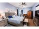 Spacious Primary bedroom with a king-size bed and wood flooring at 518 Grand Reserve Dr, Davenport, FL 33837