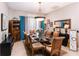 Elegant dining room featuring a glass table and six chairs at 518 Grand Reserve Dr, Davenport, FL 33837