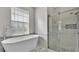 Spa-like bathroom featuring a freestanding soaking tub and a large shower at 5181 Ashwood Dr, Lakeland, FL 33811