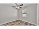 Bright bedroom with ceiling fan and wood-look flooring at 5181 Ashwood Dr, Lakeland, FL 33811