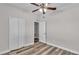 Bedroom with double doors leading to an attached bathroom at 5181 Ashwood Dr, Lakeland, FL 33811