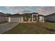 One-story home with attached garage and landscaped yard at 5181 Ashwood Dr, Lakeland, FL 33811