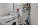 Bright laundry room, features washer and dryer, and ample storage at 5181 Ashwood Dr, Lakeland, FL 33811