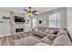 Cozy living room with a sectional sofa and a fireplace at 5181 Ashwood Dr, Lakeland, FL 33811