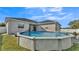 Large above ground pool in backyard oasis at 5181 Ashwood Dr, Lakeland, FL 33811