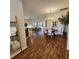 Open dining area with wood floors and views of the living room and kitchen at 5269 Pebble Beach Blvd, Winter Haven, FL 33884