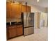 Kitchen boasts stainless steel appliances and wood cabinetry at 5269 Pebble Beach Blvd, Winter Haven, FL 33884