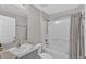 Clean bathroom with a bathtub, shower, and vanity with a sink at 5440 Siltstone St, Lakeland, FL 33811