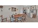 Dining room featuring a modern table set, adjacent to the kitchen area with stainless appliances at 5440 Siltstone St, Lakeland, FL 33811