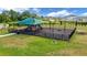 playground with shaded area, play structures, and safety surfacing at 5440 Siltstone St, Lakeland, FL 33811