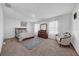 Main bedroom with ample space, featuring a dresser and seating area at 5557 Oro Valley Rd, Auburndale, FL 33823