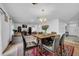 Open concept dining area with a view into the living room at 5557 Oro Valley Rd, Auburndale, FL 33823